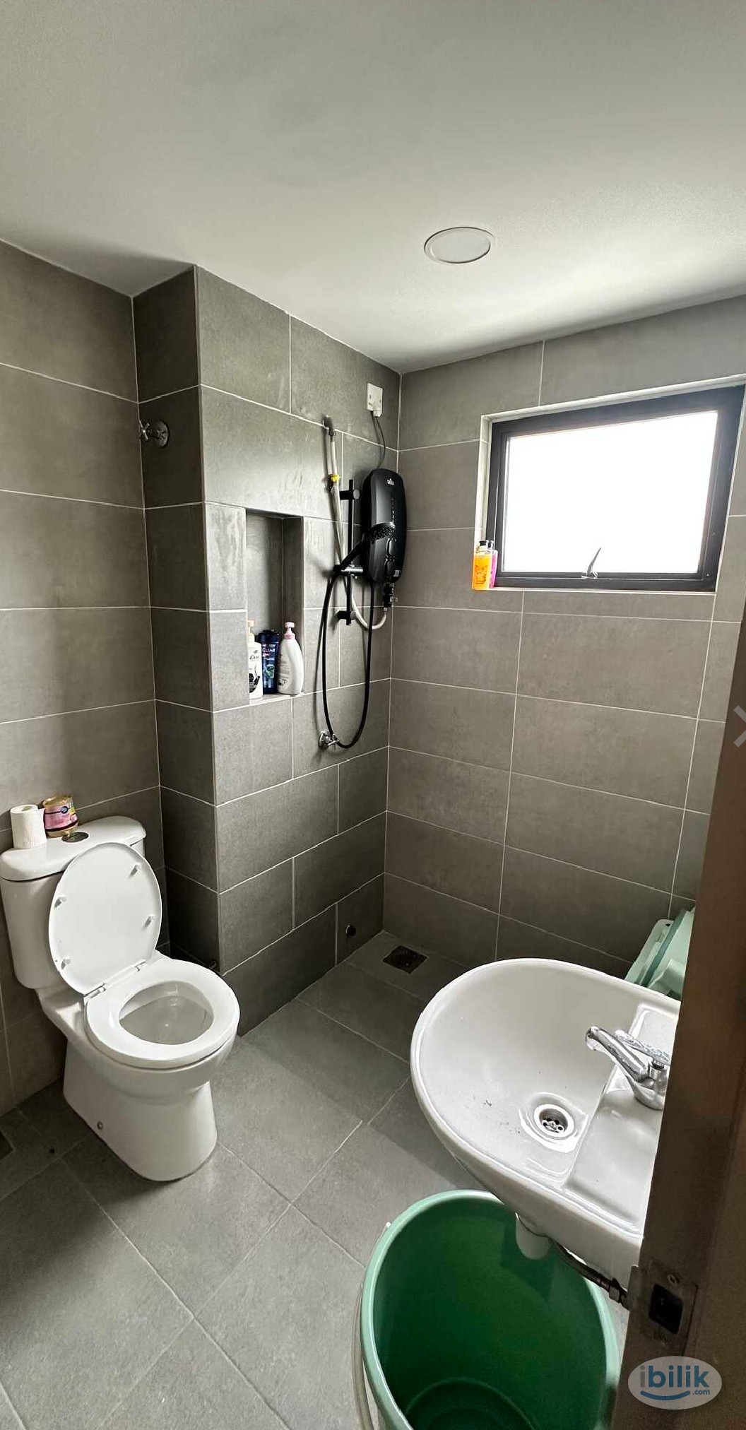 A condo common room with a private bathroom for the tenant's own use. - Image 3