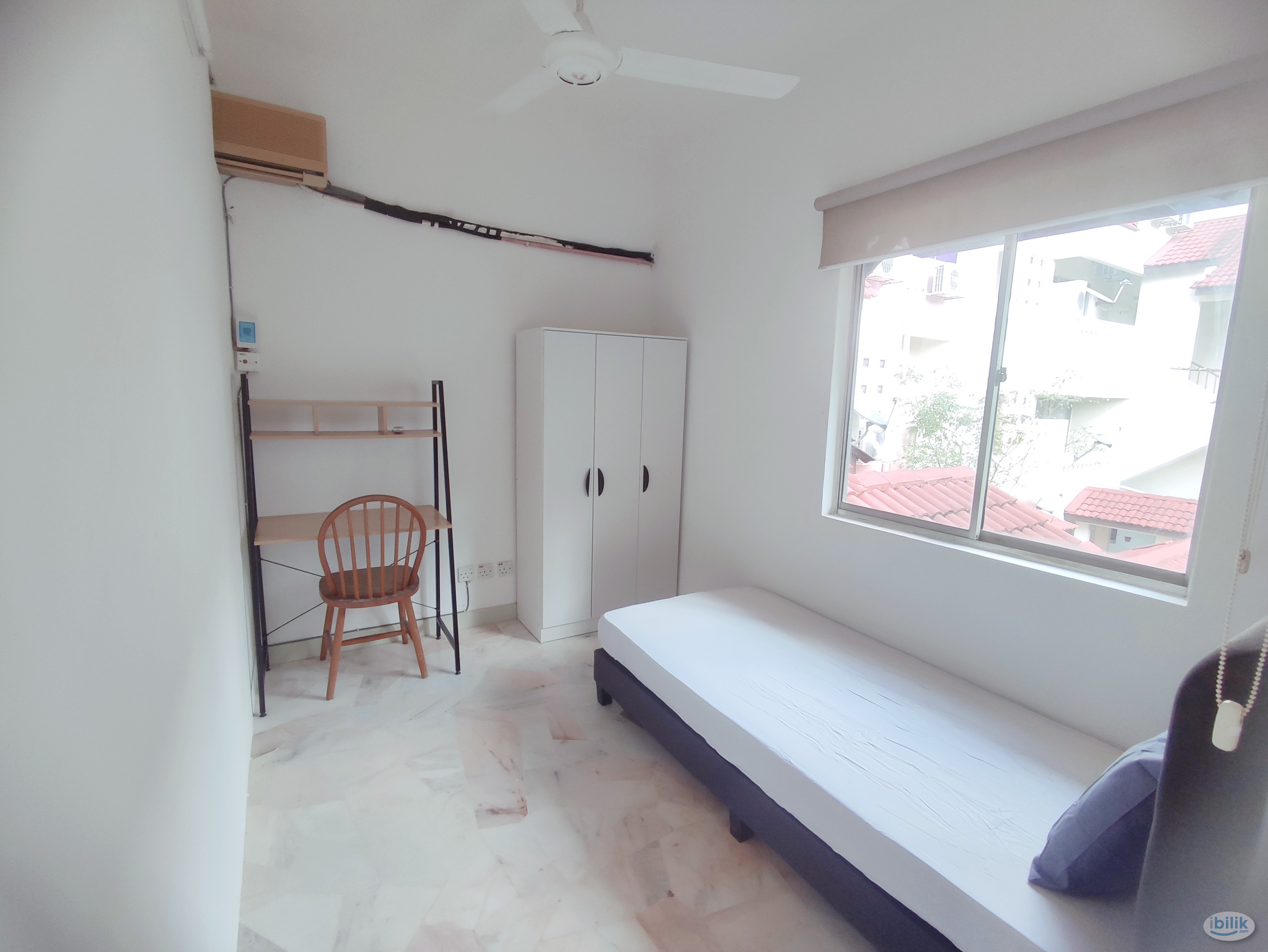 Female single window aircon room at Kiara green townhouse - Image 1